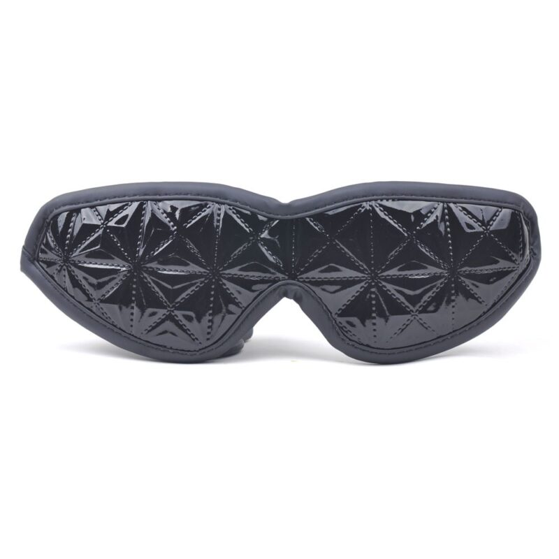Dive into a world of controlled sensuality with this black embossed mask, a must-have for fans of gentle domination games.